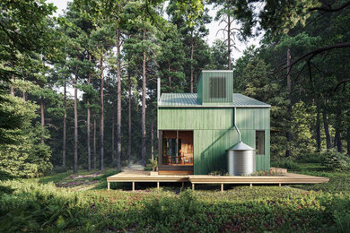Modelo de fachada de casa verde escandinava pequeña de dos plantas con revestimiento de madera, tejado de un solo tendido y tejado de metal