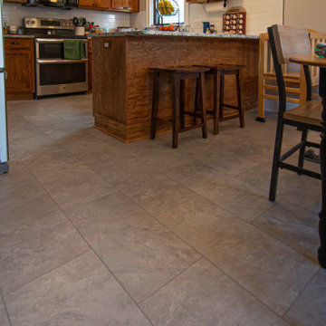 Bathroom/Laundry Room Using Warmer Tones, Accented by New Laundry Facility