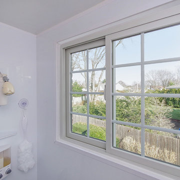 Sliding Window with Grilles in White Bathroom