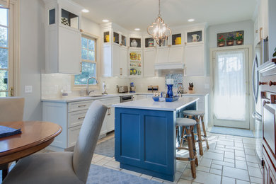 Example of a mid-sized l-shaped ceramic tile and white floor eat-in kitchen design in Grand Rapids with a single-bowl sink, recessed-panel cabinets, white cabinets, quartzite countertops, white backsplash, glass tile backsplash, stainless steel appliances, an island and white countertops