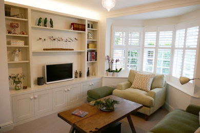 Medium sized bohemian enclosed living room in Other with a freestanding tv.