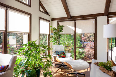Example of a 1950s open concept dark wood floor family room design in Atlanta with white walls, a standard fireplace and a wall-mounted tv