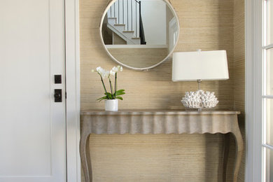 Example of a transitional single front door design in Boston with beige walls and a white front door