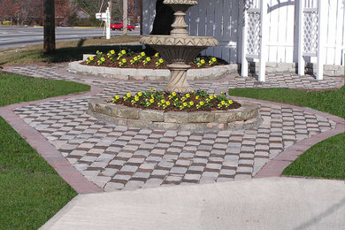 Photo of a large full sun concrete paver landscaping in Atlanta.