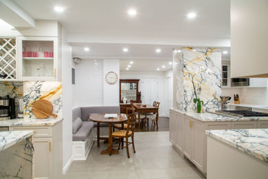 Example of a large transitional u-shaped slate floor, gray floor and coffered ceiling eat-in kitchen design in New York with a double-bowl sink, shaker cabinets, gray cabinets, marble countertops, white backsplash, stone slab backsplash, stainless steel appliances and an island