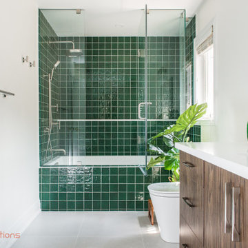 Vibrant Green Ceramic Tiles Bring Life to a Hallway Bathroom