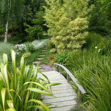 Japanese bridge with flagstone path