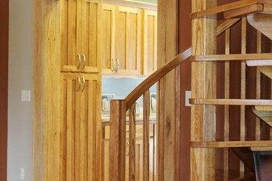 Example of a small mountain style wooden spiral open staircase design in Nashville