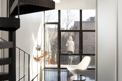 Photo of a contemporary hallway in Boston with black floor.