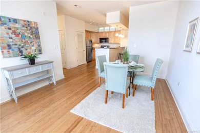Small elegant medium tone wood floor dining room photo in Richmond