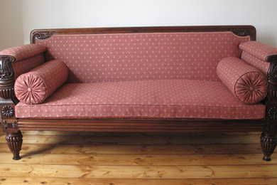 Traditional reupholstered Empire Settee.