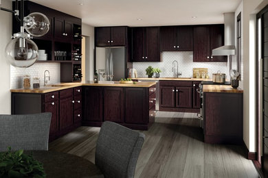 Kitchen - contemporary gray floor kitchen idea in Boston with shaker cabinets, dark wood cabinets, stainless steel appliances and a peninsula