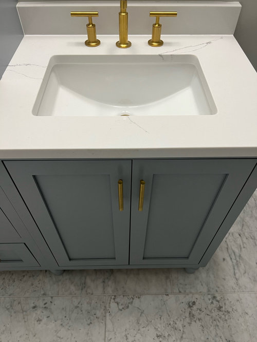 Countertop and sinks out of alignment with vanity doors worth fixing?