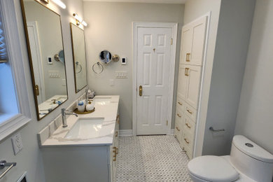 Example of a large classic master white tile and ceramic tile marble floor, white floor and double-sink bathroom design in Toronto with shaker cabinets, white cabinets, a one-piece toilet, gray walls, an undermount sink, quartz countertops, white countertops and a freestanding vanity
