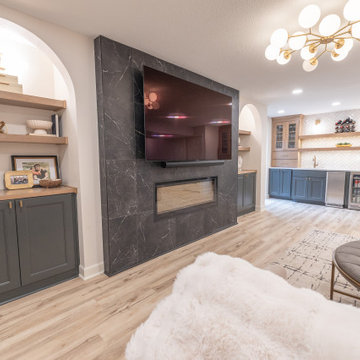 Warm & Inviting Basement Retreat with Custom Bar + Entertainment Center