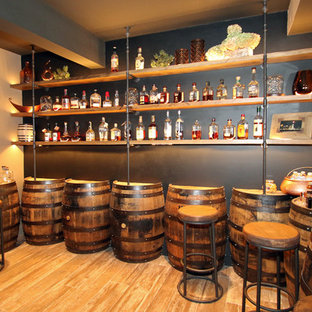 Design ideas for a large rustic fully buried basement in Cincinnati with grey walls, porcelain flooring and no fireplace.