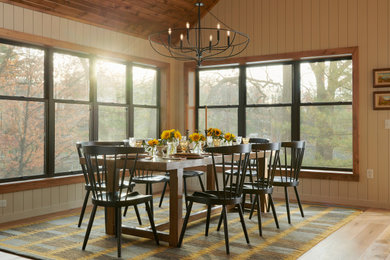 Inspiration for a rustic light wood floor, beige floor, vaulted ceiling, wood ceiling and wallpaper dining room remodel in Minneapolis with beige walls