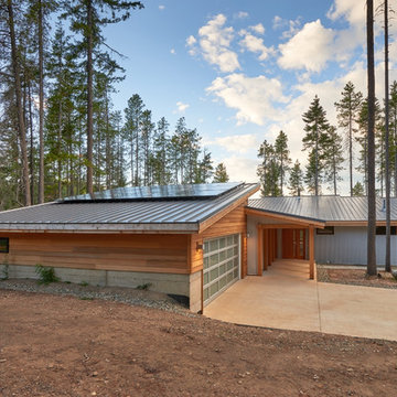 View of roofline, including solar panels on garage roof.