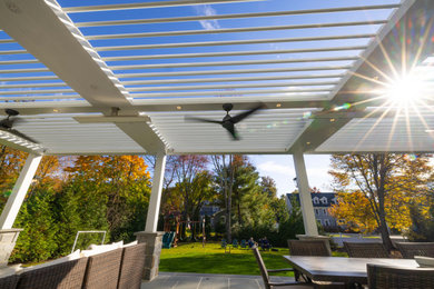 Louvered Pergola Installation over Outdoor Bar and Patio Seating Area.  Life Out