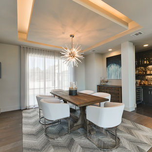Dining room - contemporary medium tone wood floor and brown floor dining room idea in Austin with gray walls