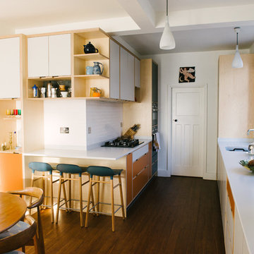 The Hennessy- Jones’s: Orange & White Laminated Plywood Kitchen