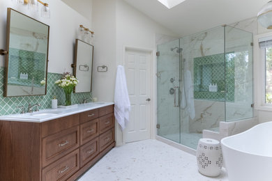 Inspiration for a transitional green tile and porcelain tile porcelain tile, white floor and double-sink bathroom remodel in Seattle with beaded inset cabinets, dark wood cabinets, white walls, an undermount sink, solid surface countertops, a hinged shower door, white countertops and a built-in vanity