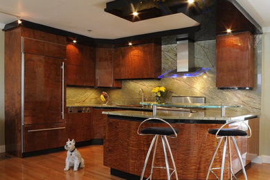 Mid-sized trendy single-wall medium tone wood floor eat-in kitchen photo in Boston with green backsplash, stone slab backsplash, paneled appliances, an undermount sink, flat-panel cabinets, medium tone wood cabinets and a peninsula