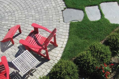 This is an example of a mid-sized traditional full sun backyard brick garden path in Seattle for summer.