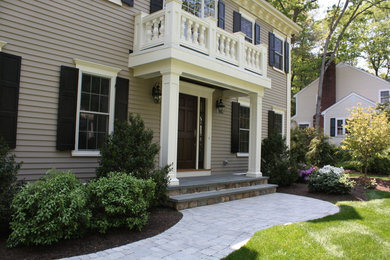 Mid-sized transitional beige two-story vinyl gable roof photo in Boston