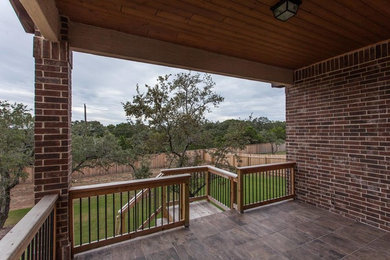 Example of an arts and crafts patio design in Austin