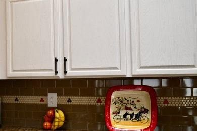 Example of a small farmhouse u-shaped ceramic tile eat-in kitchen design in Albuquerque with an undermount sink, raised-panel cabinets, white cabinets, granite countertops, brown backsplash, ceramic backsplash and stainless steel appliances