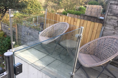Glass balustrade with handrail, fitted in Horwich.