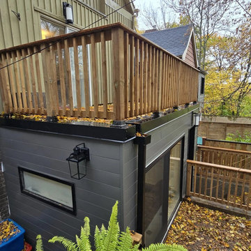 The roof deck seen from the garden with the extension below, Toronto