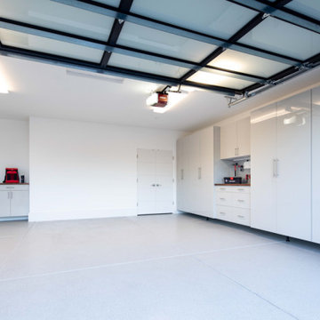 Sleek White Garage Cabinets with Integrated Workstation