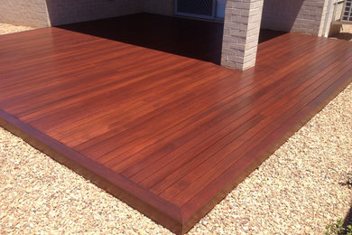 Example of a mid-sized trendy backyard deck design in Melbourne