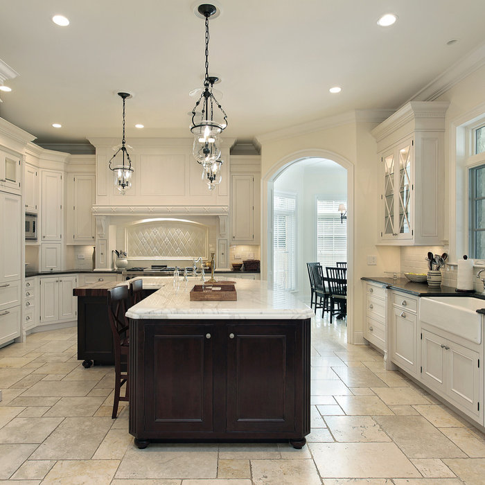 Enclosed kitchen - large transitional u-shaped limestone floor and beige floor enclosed kitchen idea in Tampa with a farmhouse sink, beaded inset cabinets, white cabinets, granite countertops, white b