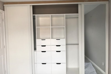 This is an example of a medium sized contemporary wardrobe in Kent.