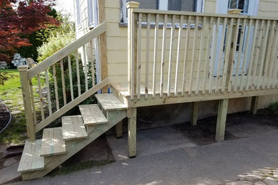 This is an example of a small traditional porch design in Philadelphia with decking.