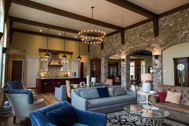Inspiration for an expansive arts and crafts formal open concept living room in Other with beige walls, medium hardwood floors, a standard fireplace, a stone fireplace surround and a wall-mounted tv.