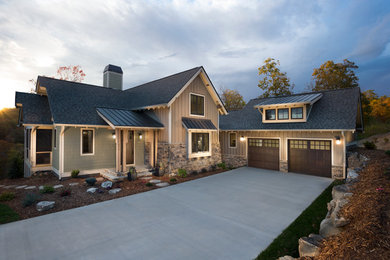 Arts and crafts one-story stone exterior home photo in Other