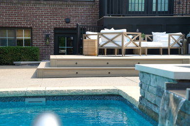 Deck - mid-sized contemporary backyard privacy and metal railing deck idea in Detroit with a pergola