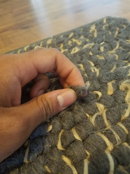 Wool rug normal or damaged?