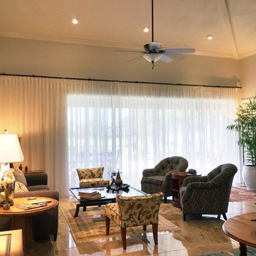 Traversing living room sheer drapery