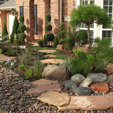 Landscaping with oversize pavers and backyard creek - hkns