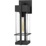 Quoizel - Wynn 1-Light Outdoor Wall Mount in Earth Black - Greet your guests with the luxe style of the Wynn collection. The rectangular silhoutte is framed in an Earth Black finish and was designed with a minimalist in mind. The clear seedy glass panels are easy to maintain and create a warm and welcoming glow when lit.  As a part of our Coastal Armour collection, you can rest assured that this fixture is built to last.  This light requires 1 , 150 Watt Bulbs (Not Included) UL Certified.