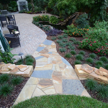 Natural Stone Dry-Stack Retaining Walls with Dry-Laid Stone Pathways