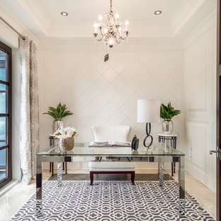 Photo of a mid-sized transitional home office in Vancouver with white walls, marble floors, no fireplace, a freestanding desk and beige floor.
