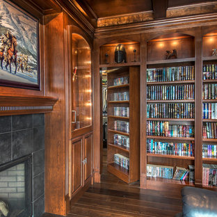 Arts and crafts home office in Other with dark hardwood floors, a standard fireplace and a tile fireplace surround.