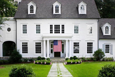 Inspiration for a french country white exterior home remodel