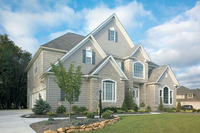 Large transitional beige two-story mixed siding house exterior photo in Salt Lake City with a hip roof and a shingle roof